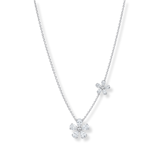 Raffi&Co.® 18K White Gold Diamond Necklace Pendant features two daisy-shaped pendants, each embellished with sparkling G/H, SI-VS clear diamonds totaling 1.65 CTW, shown on a plain white background.