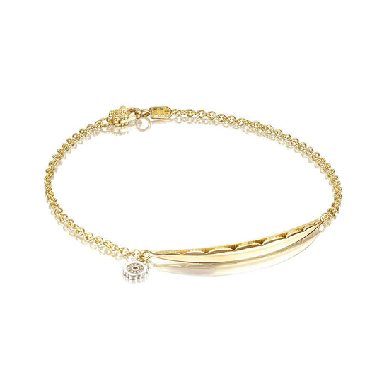 The Tacori Ivy Lane 18K Yellow Gold Tendril Bracelet by Tacori is an elegant, minimalist piece featuring a curved bar, small circular charm, and polished finish. It also includes a lobster clasp closure for easy wear.