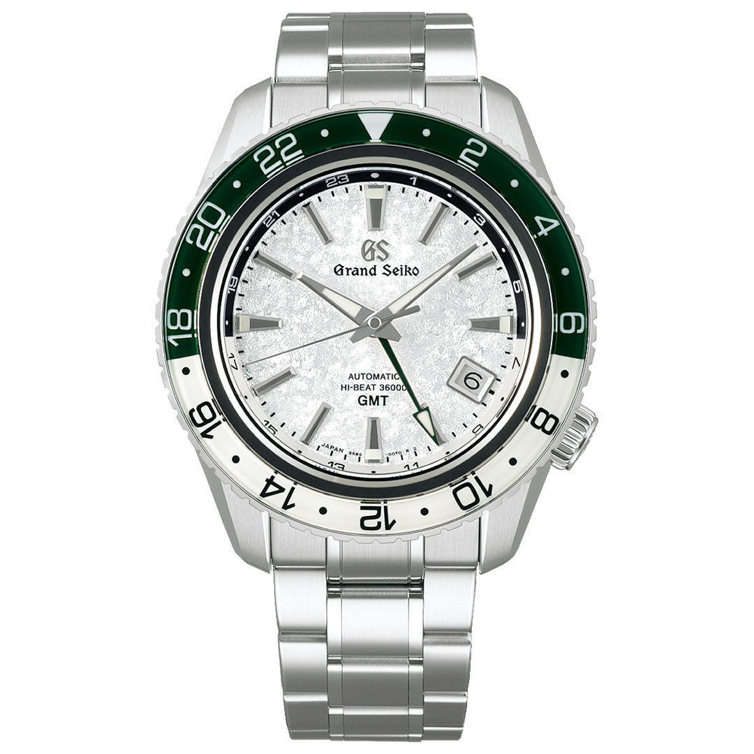 The Grand Seiko Sport Collection Automatic with Manual Winding GMT 44.2mm Watch, taking inspiration from a snowy valley, features a stainless steel case paired with a silver textured dial. The Hi-Beat 36000 GMT Caliber 9S86 works seamlessly with its green and silver rotating 24-hour bezel. The watch is elegantly finished with silver hands, a date window at the 4 o'clock position, and comes on a metal bracelet.