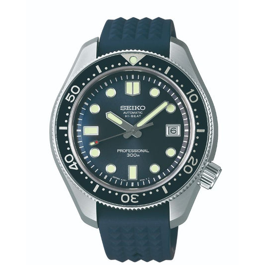 The Seiko Prospex Diver's 55th Anniversary Limited Edition Automatic with Manual Winding 44.8mm Watch boasts a black dial with bold luminous markers, a date window at 3 o'clock, and a black rotating bezel. It is complemented by a blue rubber strap and features "Automatic Hi-Beat Professional 300m" markings.