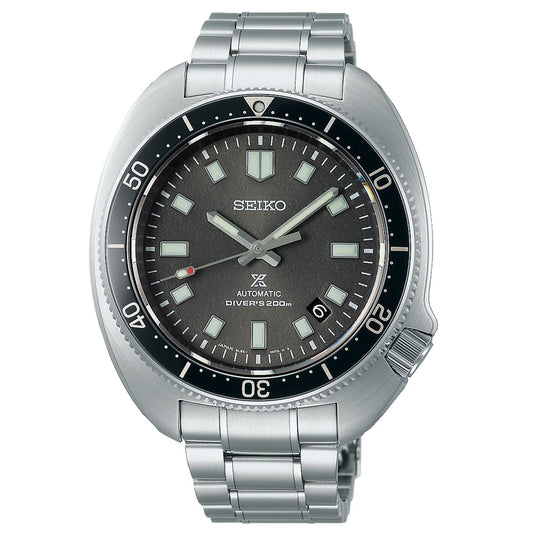 The Seiko Prospex Sea Automatic With Manual Winding 44mm Watch showcases cutting-edge technology with its silver stainless steel bracelet. It has a black round bezel featuring minute markers, and the gray dial presents prominent hour markers and hands, along with a convenient date window positioned near three o'clock.