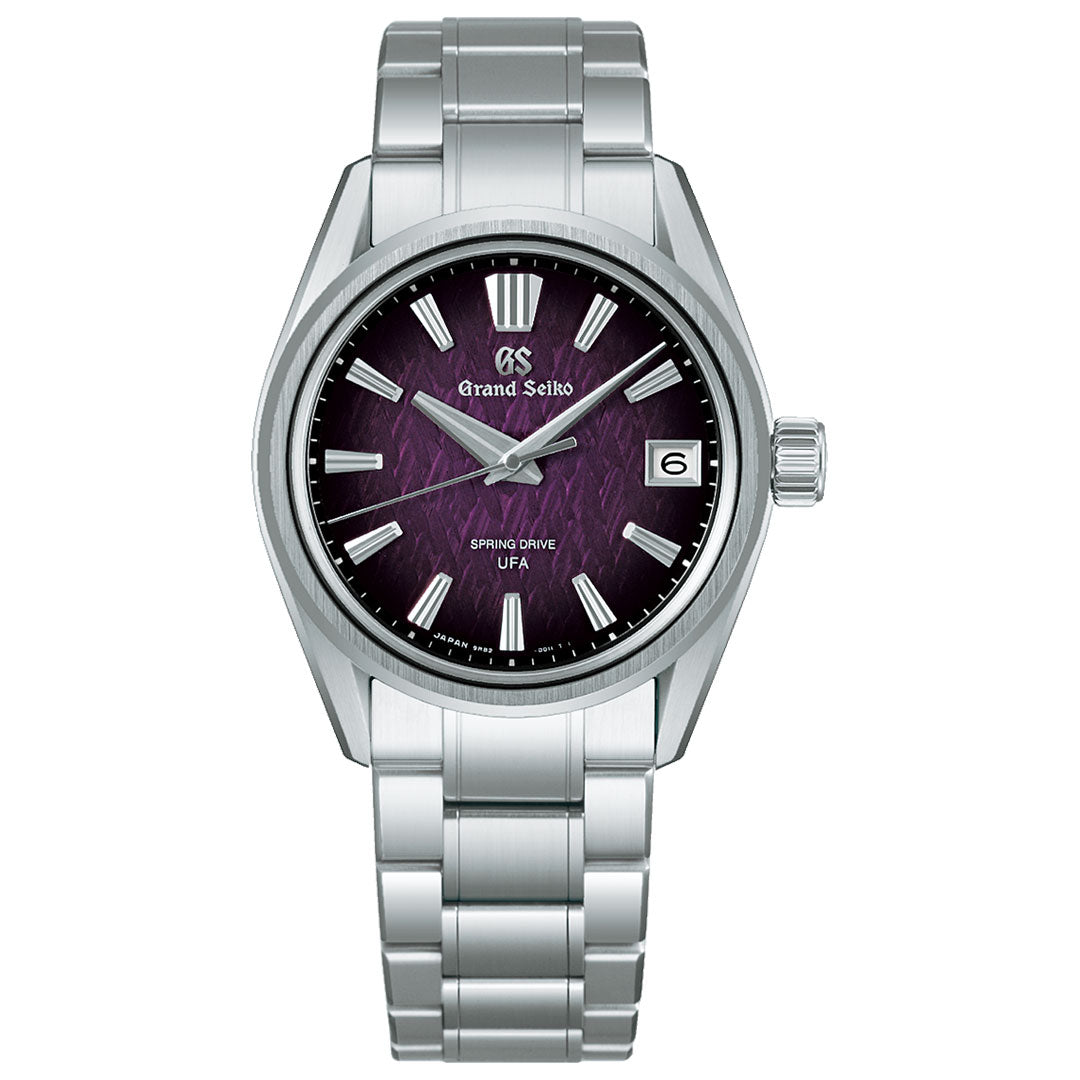 The Grand Seiko Evolution 9 Collection Spring Drive 37mm Watch, a limited edition of 1,300 pieces, features a silver metal bracelet, purple textured dial with silver markers, date at 3 o’clock, and Caliber 9RB2 for ultra-fine accuracy.