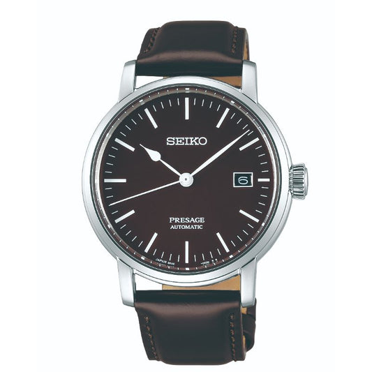 The Seiko Presage Prestige Line Automatic With Manual Winding 39.9mm Watch blends Japanese aesthetics with durable performance. Its sophisticated design includes a brown leather strap, a brown dial, and silver hour markers, all showcasing excellence in mechanical watchmaking. A stainless steel case completes this elegant timepiece.