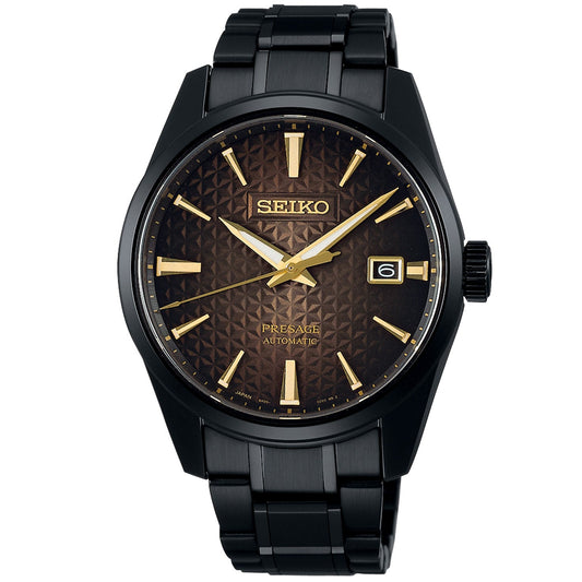 The Seiko Presage Prestige Line 140th Anniversary Limited Edition Automatic With Manual Winding 39.3mm Watch exemplifies Japanese aesthetic elegance, featuring a black metal band and a dial with a dark brown textured pattern complemented by gold hour markers, hands, and a date display at the 3 o'clock position, embodying the art of Seiko mechanical watchmaking.