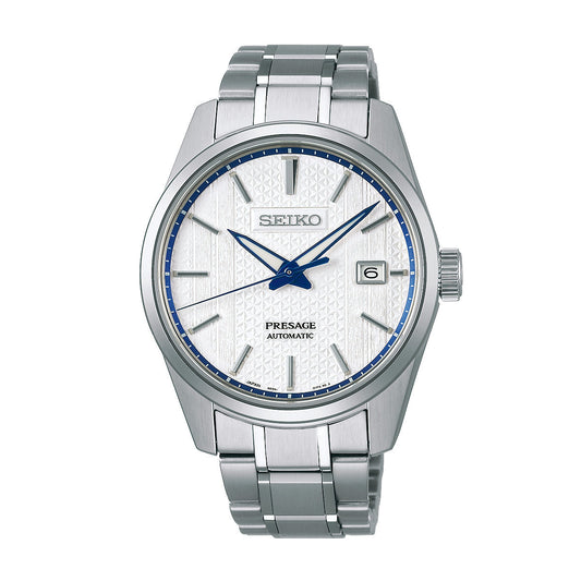 The Seiko Presage Sharp Edged Series Zero Halliburton Limited Edition Automatic Watch highlights Japanese aesthetic excellence with its 39.3mm silver stainless steel band. It features a white textured dial adorned with blue hour markers and a date window at the 3 o'clock position, exuding elegance. The metal case and luminescent hands further enhance its refined design.