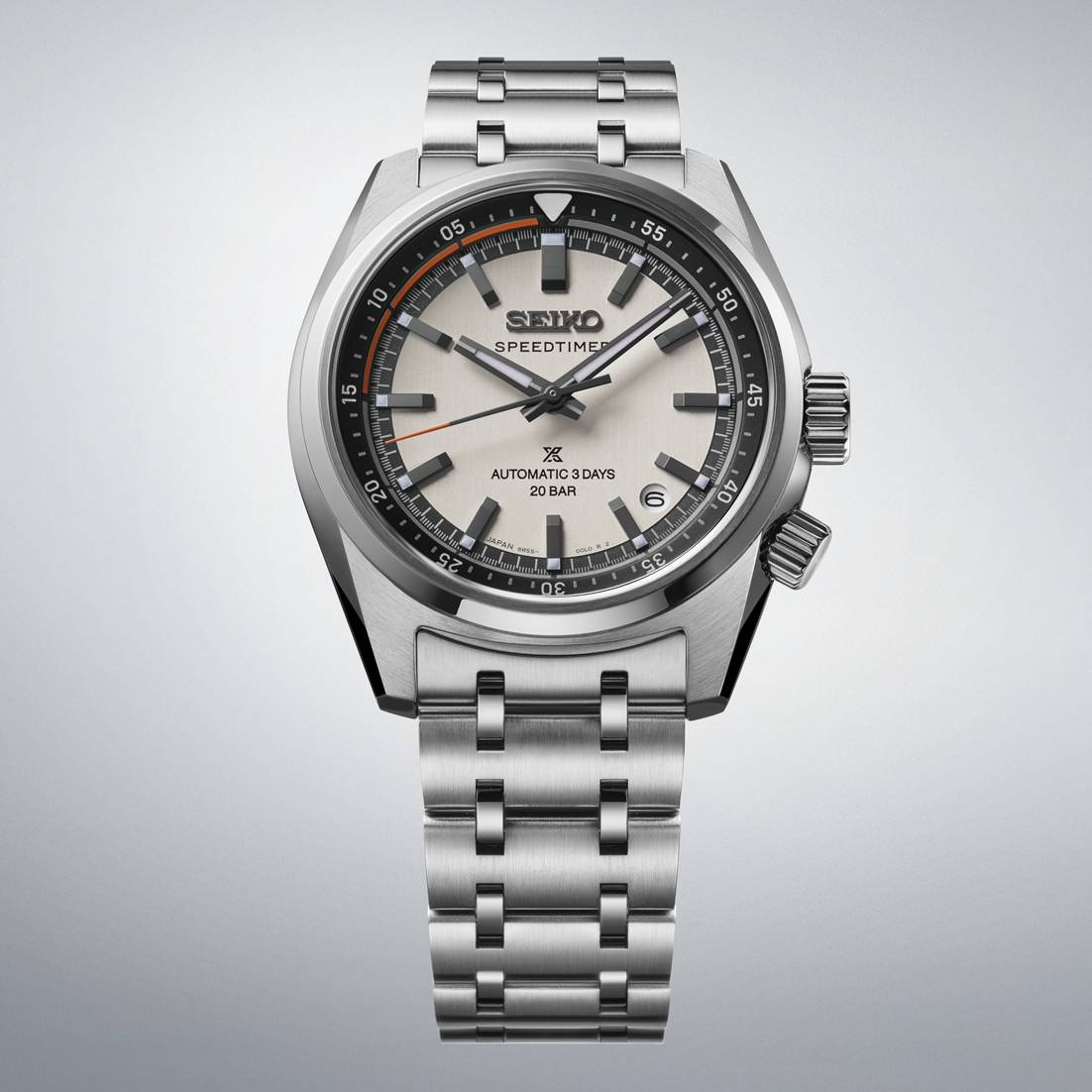Seiko Prospex Speedtimer Automatic With Manual Winding 39.5mm watch featuring a silver-tone stainless steel finish, light grey dial, dark grey indices, an orange accented outer track, and a multi-link metal bracelet.