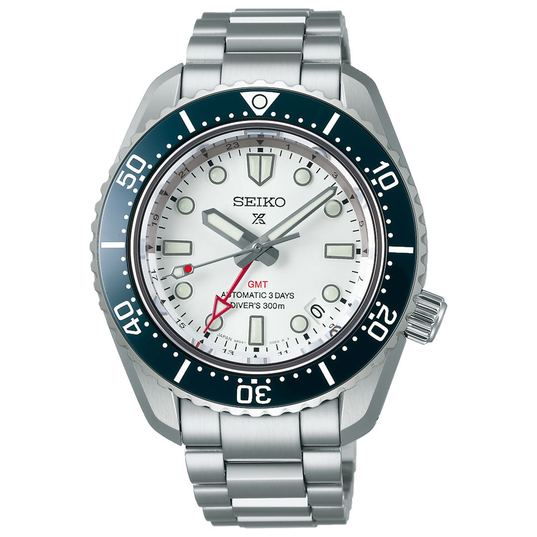 The Seiko Prospex Sea 1965 Diver's GMT Automatic 42mm Watch features a silver metal band, white dial, black and silver ceramic bezel, red GMT hand, automatic movement, and is water-resistant to 300 meters.