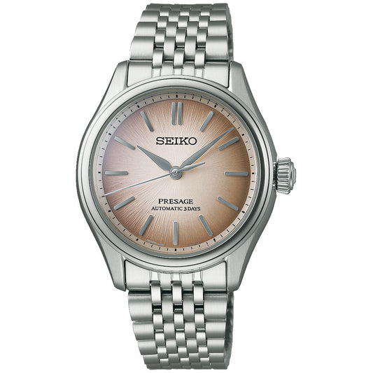 The Seiko Presage Classic Series Automatic With Manual Winding 41mm Watch features a stainless steel case and band, a light brown sunburst dial, silver markers, three hands, and displays "SEIKO" and "PRESAGE AUTOMATIC 3 DAYS" on the face.