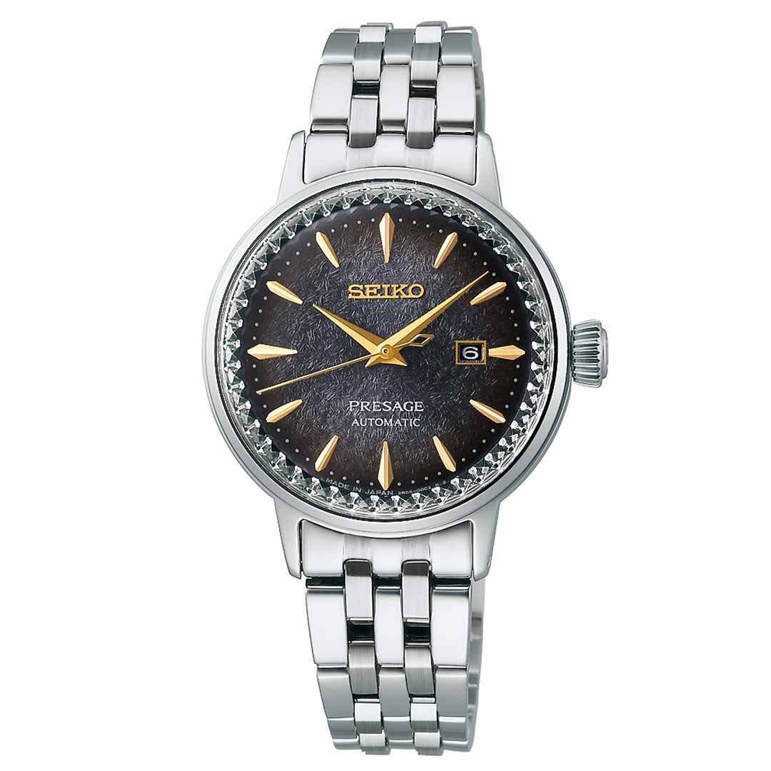 The Seiko Presage Cocktail Time Automatic 30.3mm Watch showcases a textured black dial, gold hour markers, and a date window at the 3 o'clock position. It is equipped with a stainless steel case and matching bracelet, complemented by a serrated bezel.