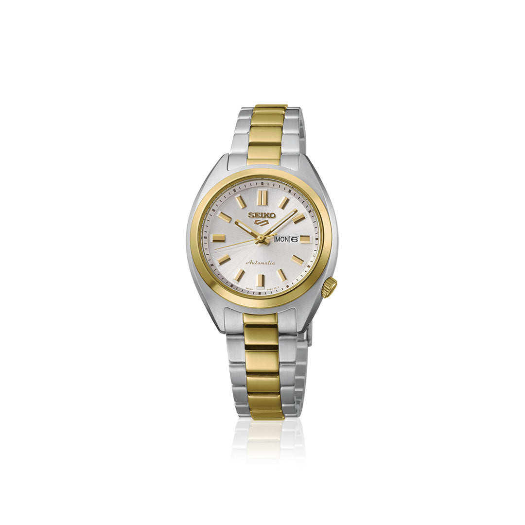 The Seiko 5 Sports SNXS Series Automatic 32mm Watch features a stainless steel band in silver and gold tones, a white dial with gold markers, and a day-date display. This classic, elegant timepiece displays the Seiko logo on the dial.