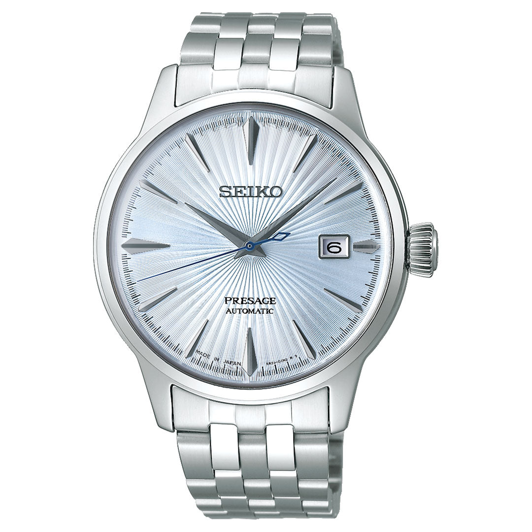 The Seiko Presage Cocktail Time Automatic 40.5mm Watch features a textured light blue dial, silver hour markers, date display at 3 o'clock, and a stainless steel bracelet.