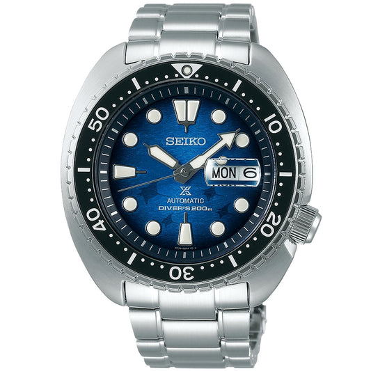 Introducing the Seiko Prospex Sea Save The Ocean Special Edition Automatic Watch. This 45mm stainless steel timepiece features a captivating blue dial and silver-tone markers. It houses the automatic Caliber 4R36, offering a day-date display alongside a unidirectional black bezel with white numerals. Complemented by a metal bracelet, this watch is water resistant to 200 meters, proudly marked as "DIVER'S 200m.