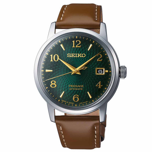 The Seiko Presage Cocktail Time Automatic 38.5mm Watch from Seiko features a captivating green textured dial adorned with gold-toned Arabic numerals and hands. Equipped with a date display at the 3 o'clock position, this elegant and functional timepiece is complemented by a brown leather strap.