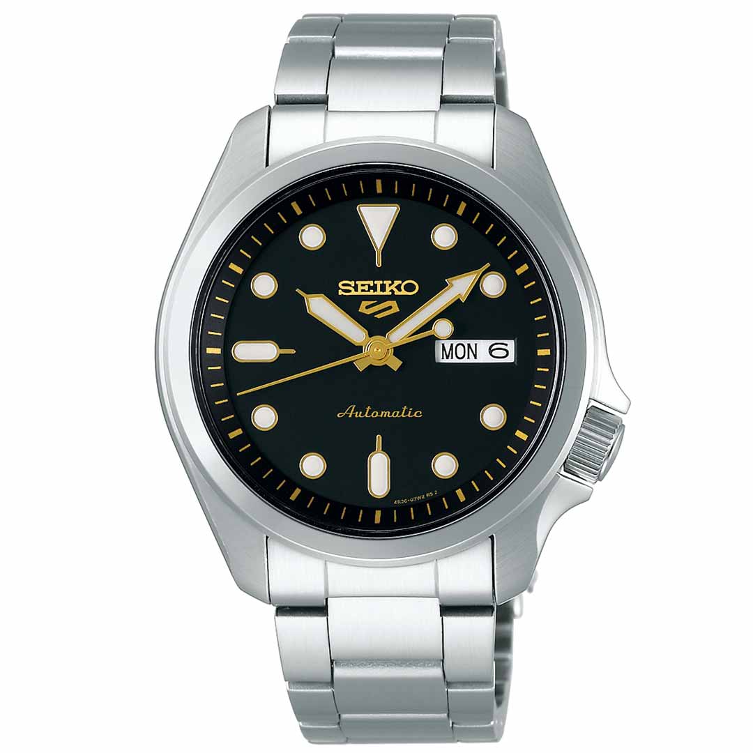 The Seiko 5 Sports SKX Series Automatic 40mm Watch by Seiko boasts a silver finish and features a striking black dial complemented by gold hour markers and hands. As an automatic timepiece, it displays the day and date on the right side. Equipped with a refined stainless steel bracelet, it offers a blend of elegance and functionality.