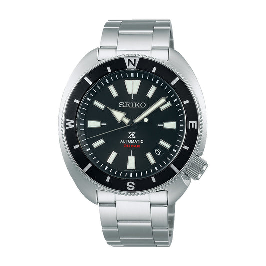 The Seiko Prospex Automatic With Manual Winding 42.4mm Watch is a striking divers watch that boasts a stainless steel band and bezel. Its black dial features prominent white hour markers and hands, with "Seiko," "Automatic," and "200m" accented in red, alongside compass markings on the bezel for enhanced functionality.