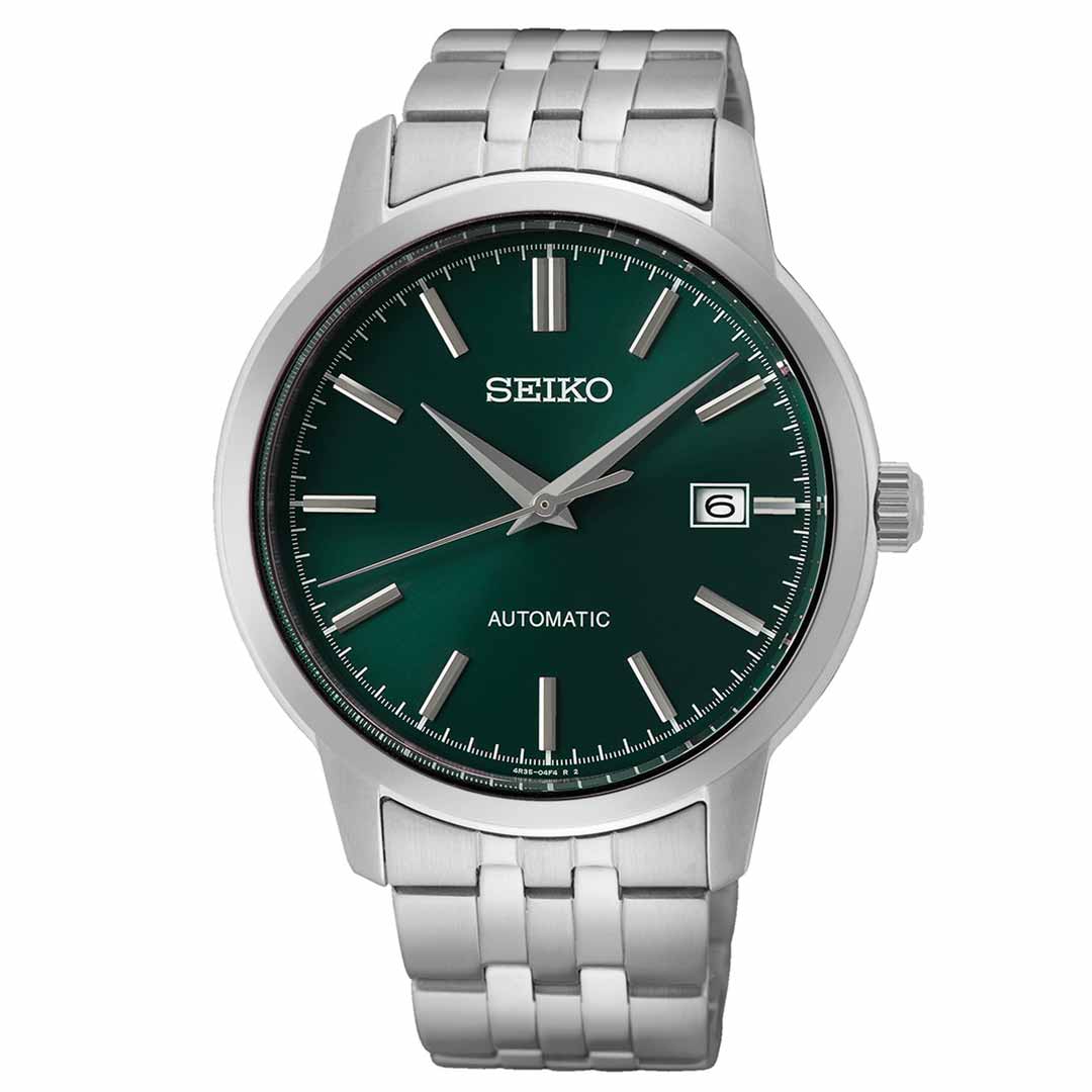 The Seiko Essentials Automatic 41.2mm Watch by Seiko showcases a captivating green dial highlighted with silver hour markers. This stainless steel timepiece includes a date window at the 3 o'clock position and is finished with an elegant silver metal link bracelet, reflecting a perfect blend of style and precision.