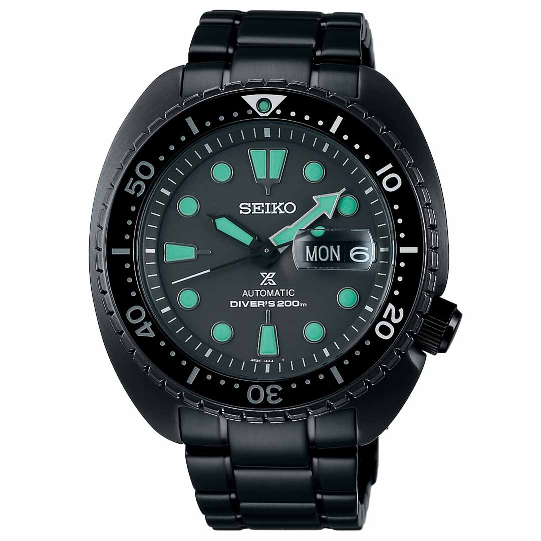 The Seiko Prospex Sea Black Series Automatic 45mm Watch features a round black face, automatic movement, and luminescent markers. It includes a day-date display and is water-resistant up to 200 meters. Its metal link bracelet pairs perfectly with the bezel's minute indicators.