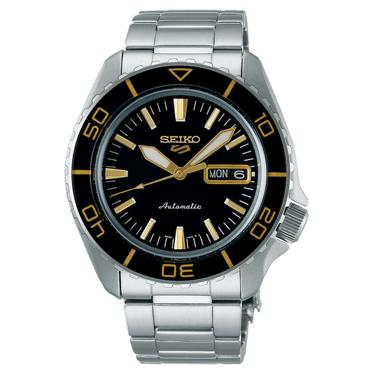 The Seiko 5 Sports SKX Series Automatic 42.5mm Watch by Seiko features a stainless steel band and a stylish black face with gold-tone hour markers. It includes luminescent hands and a numbered bezel in gold, adding sophistication, while the day and date display is conveniently located at the 3 o'clock position.