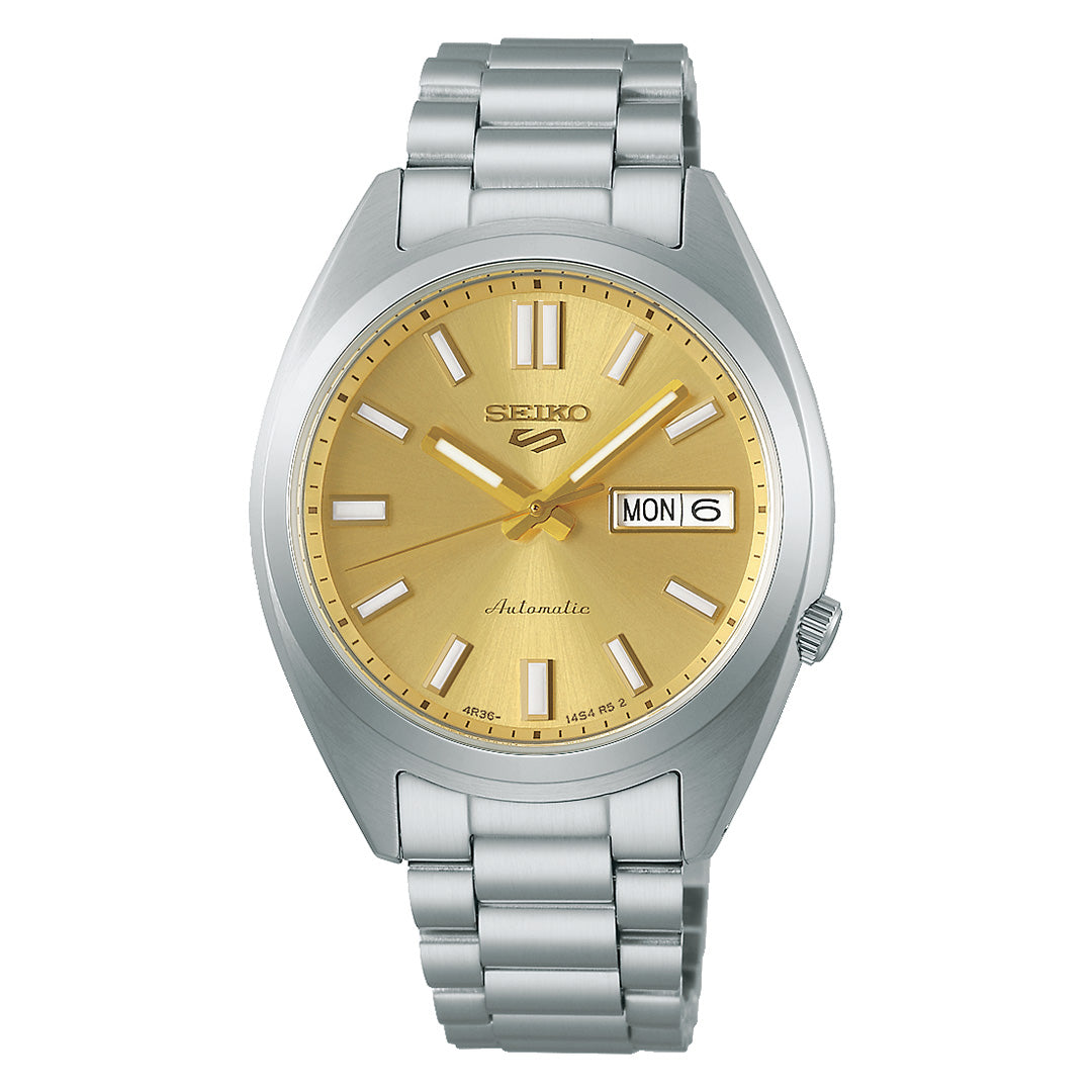 The Seiko 5 Sports SNXS Series Automatic 37.4mm Watch by Seiko showcases a gold dial with silver hour markers and hands, a stainless steel bracelet, and a day-date display at the 3 o’clock position—a timeless stainless steel timepiece crafted for both style and reliability.