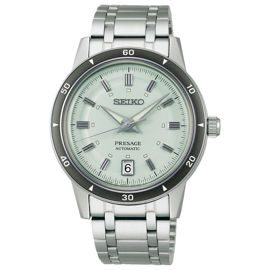 The Seiko Presage Style 60's Automatic with Manual Winding 39.5mm Watch features a silver case, light green dial, date window at 6 o’clock, silver markers and hands, and a stainless steel bracelet.