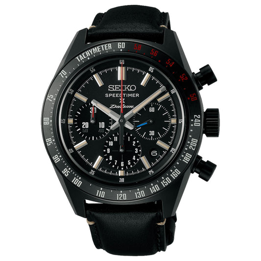 The Seiko Prospex Speedtimer Datsun 240Z Chronograph Automatic 42mm Watch, a limited edition of 500 pieces, features a black dial with three subdials, white and red details, a tachymeter bezel, and a black leather strap.