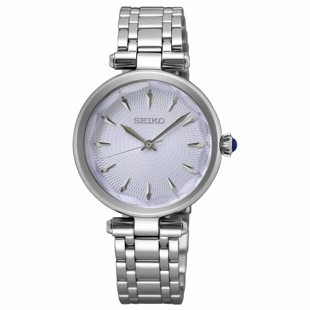 The Seiko Classique Quartz 30mm Watch by Seiko features a textured white dial, a stainless steel bracelet, and silver hour markers. A blue accent on the crown adds an elegant and precise touch to the design.