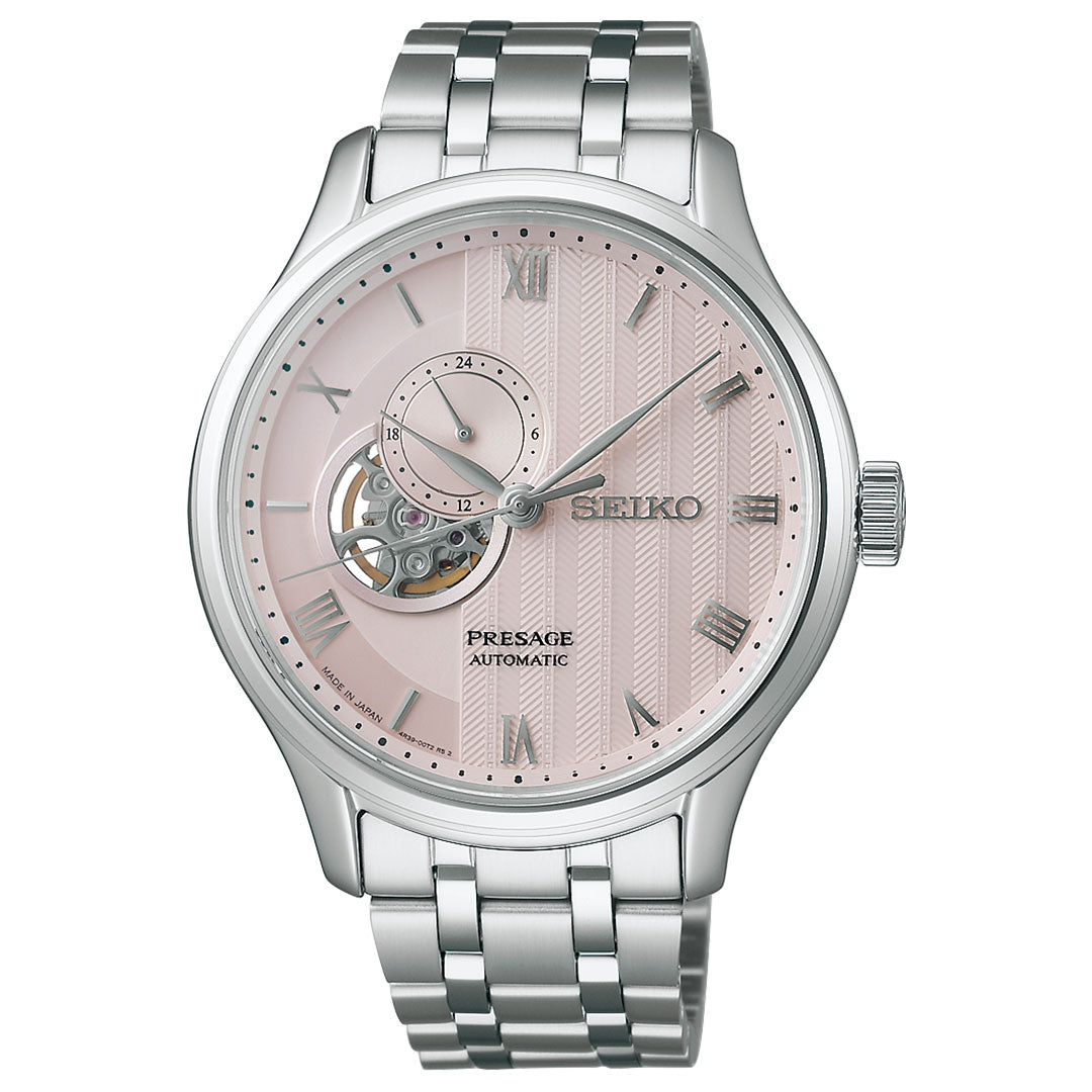 The Seiko Presage Japanese Garden Automatic 41.8mm Watch features a silver metal band, pink textured dial with Roman numerals, open-heart window, and 24-hour subdial.