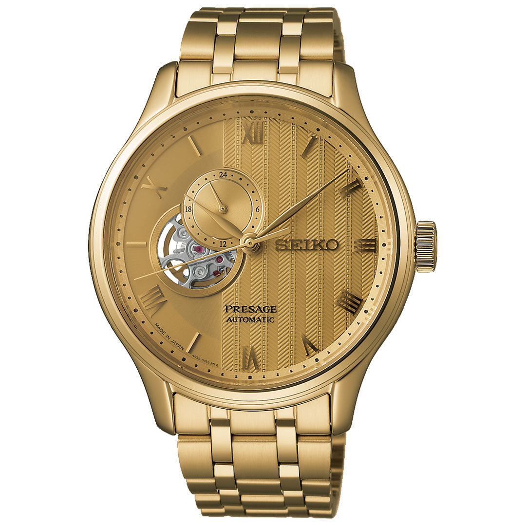 The Seiko Presage Japanese Garden Automatic 41.8mm Watch features a gold-tone case, metallic link band, open-heart dial with Roman numerals, and a patterned gold face, showcasing Seiko’s signature craftsmanship.