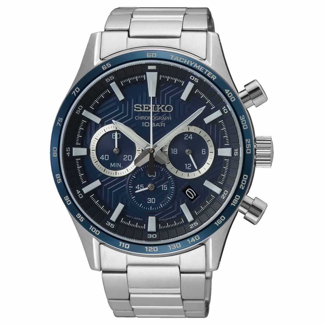 The Seiko Essentials Quartz 43mm Watch by Seiko features a captivating blue dial with three sub-dials, a date window, and a tachymeter scale. Its stainless steel design is enhanced by silver hour markers, an elegant metal bracelet, and three pushers on the side.