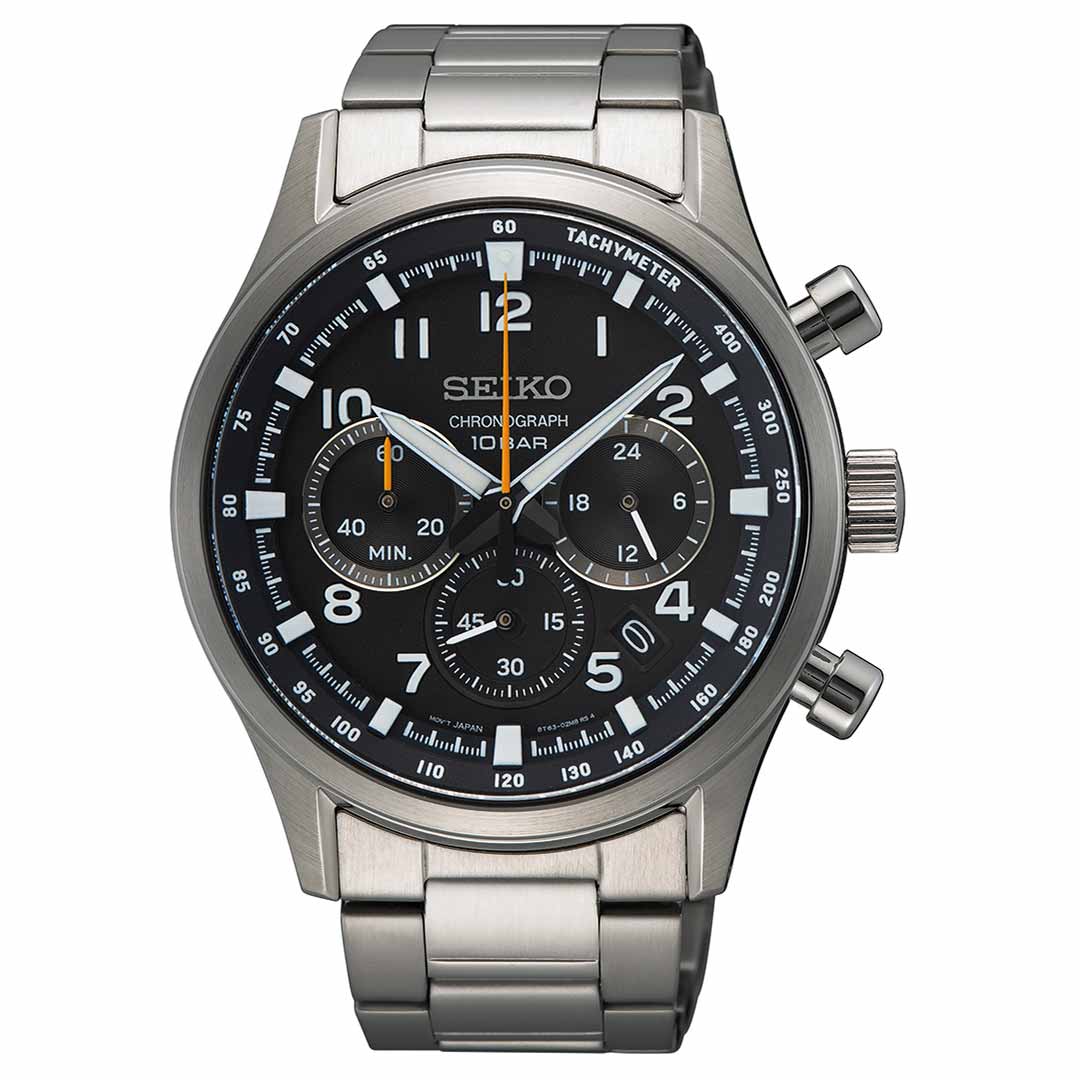 The Seiko Essentials Quartz 43mm Watch is a stainless steel timepiece featuring a black dial accented with white and orange details. It includes three subdials, a date window, and a tachymeter scale around the edge, paired with a silver metal bracelet.