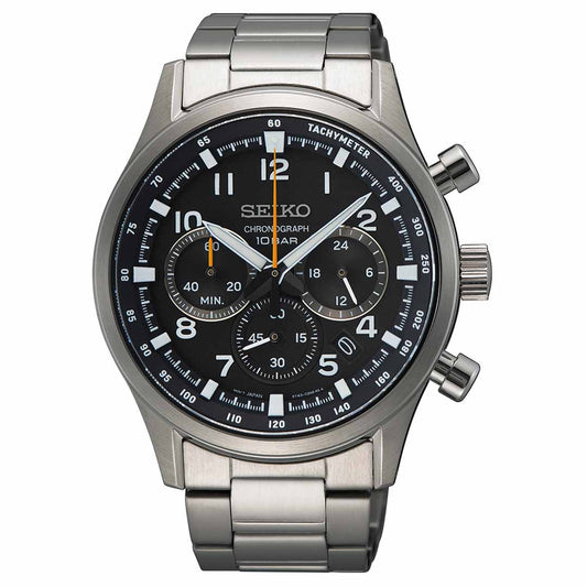 The Seiko Essentials Quartz 43mm Watch is a stainless steel timepiece featuring a black dial accented with white and orange details. It includes three subdials, a date window, and a tachymeter scale around the edge, paired with a silver metal bracelet.