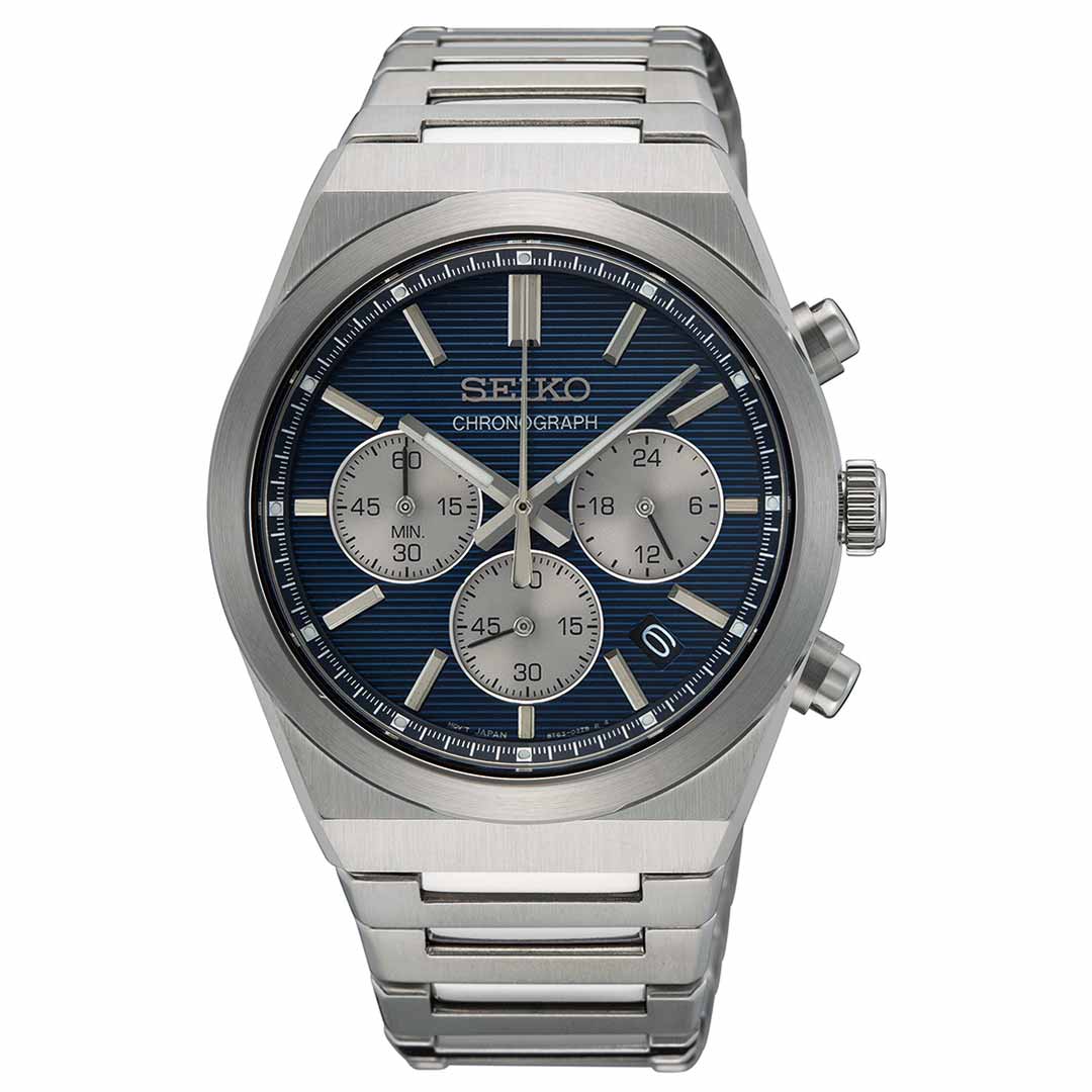 The Seiko Essentials Quartz 40mm Watch features a sophisticated design with a stainless steel bracelet. It showcases a striking blue dial, three sub-dials for chrono functions, and a date window positioned at 4 o'clock, with the "Seiko Chronograph" elegantly displayed on its face.