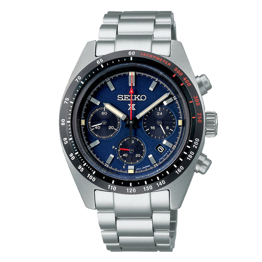 The Seiko Prospex Solar 39mm Watch is an innovative timepiece featuring a silver design with a blue dial, three subdials, date display, and a tachymeter on the bezel. It includes a stainless steel bracelet band and silver-tone hour markers.