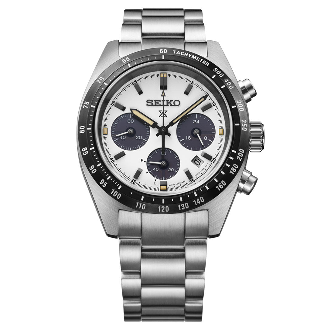The Seiko Prospex Speedtimer Solar Chronograph 39mm Watch features a white dial with three black sub-dials, sandblast finish, date at 4 o’clock, tachymeter bezel, and metal bracelet with black and yellow accents.