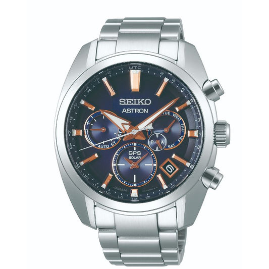 The Seiko Astron GPS Solar 42.7mm Watch from Seiko boasts a silver metal band and a dark, detailed dial with three subdials. It is equipped with GPS signal reception and highlighted by orange-gold accents. The case features three push buttons on the side, blending style with functionality for today's travelers.