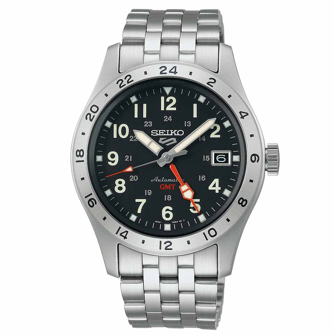 The Seiko 5 Sports Field Series Automatic 39.3mm Watch by Seiko showcases a stainless steel band and a black dial with white numerals. It includes a date window at 3 o'clock, an orange GMT hand, and a bezel with 24-hour markers.