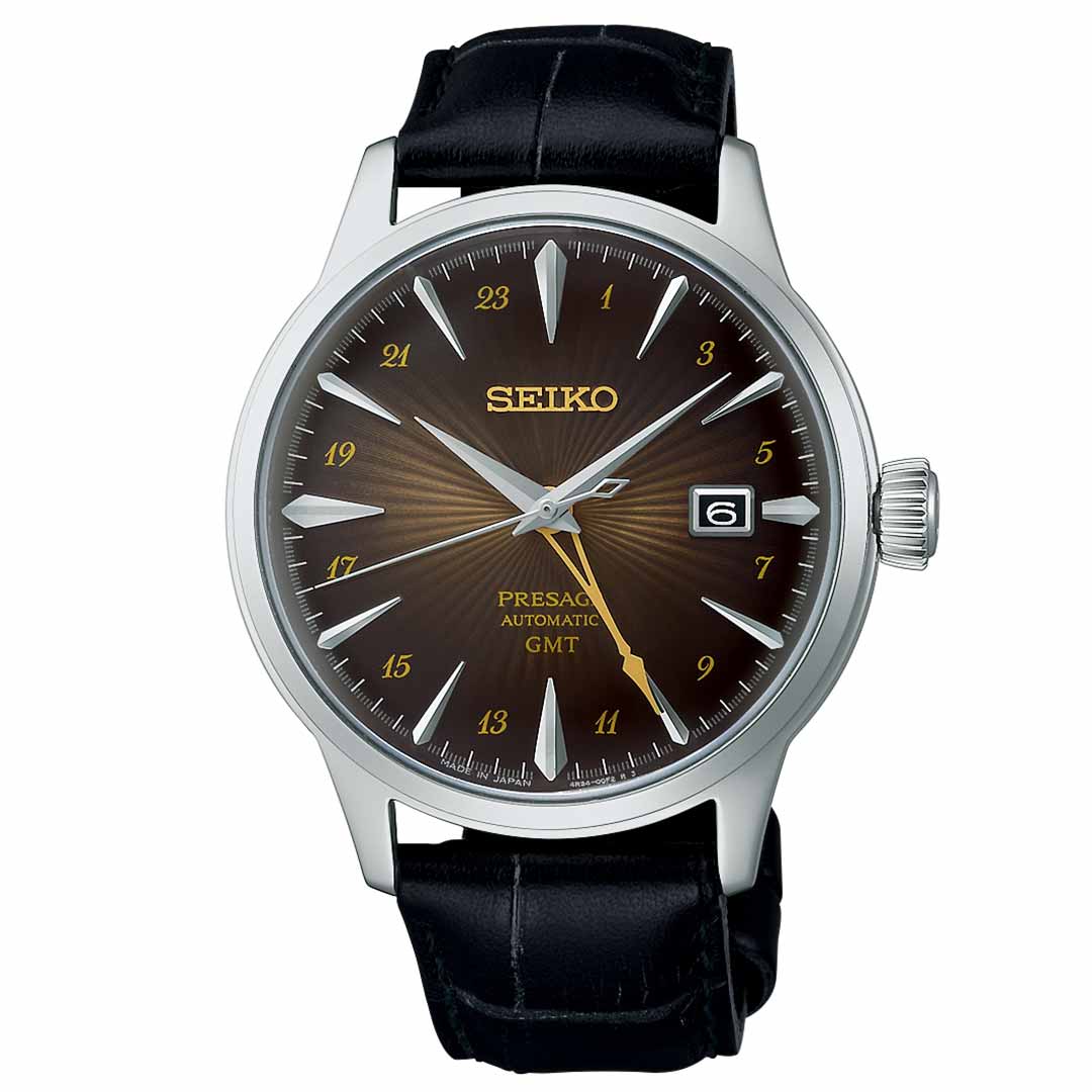 The Seiko Presage Cocktail Time Automatic 40.5mm Watch from Seiko features a striking dark brown sunburst dial complemented by silver hour markers and includes a date window at the 3 o'clock position. This sophisticated timepiece seamlessly pairs a black leather strap with a classic stainless steel case.