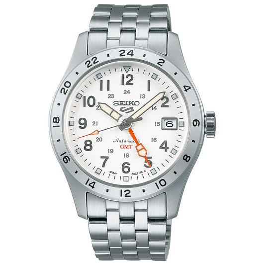 The Seiko 5 Sports Field Series Automatic 39.4mm watch features a white dial, silver-tone stainless steel case and bracelet, black hour markers, date window at 3 o’clock, and a red GMT hand pointing to 22 on the bezel.