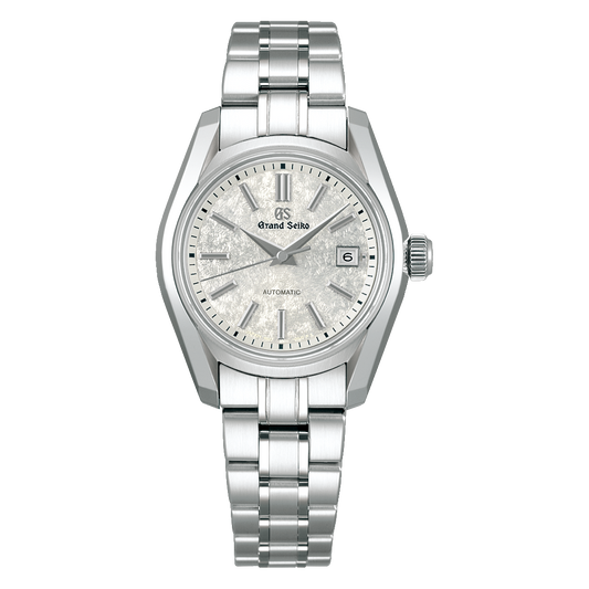 The Grand Seiko Heritage Collection Automatic with Manual Winding 30mm Watch features a stainless steel case and bracelet with Zaratsu polishing, a textured silver dial, silver markers and hands, date at 3 o’clock, and Grand Seiko branding below 12.