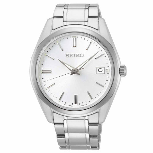 The Seiko Essentials Quartz 40.2mm Watch from Seiko features a white dial with sleek stainless steel band and silver hour markers, hands, and a date display at 3 o'clock, all shielded by durable sapphire crystal. Its minimalist design embodies timeless elegance.