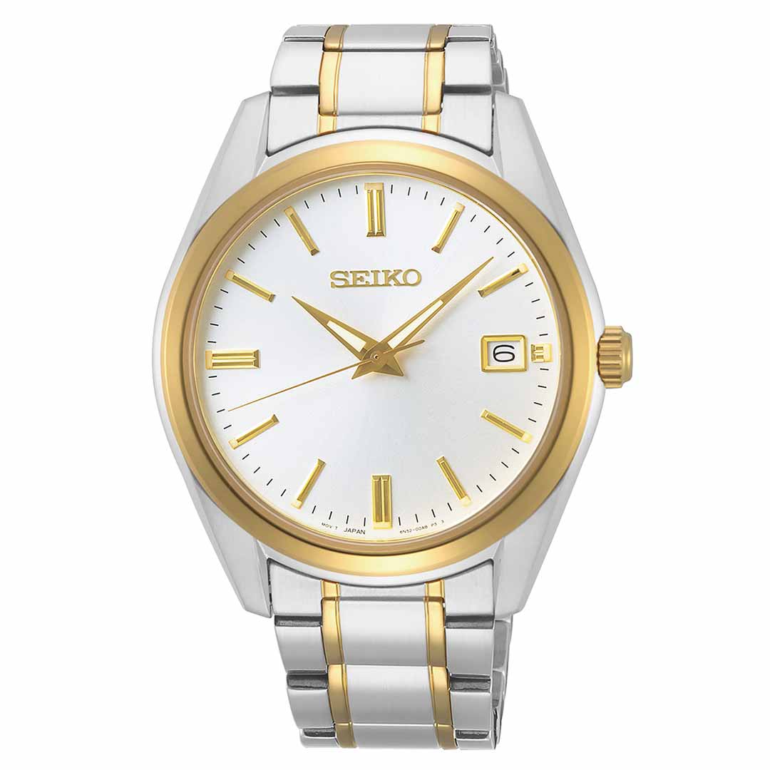 The Seiko Essentials Quartz 40.2mm Watch by Seiko boasts a gold-plated stainless steel band that elegantly contrasts with silver accents. The timepiece has a round face shielded by sapphire crystal, featuring a white background with gold hour markers and hands, plus a date display window located at the 3 o'clock position.