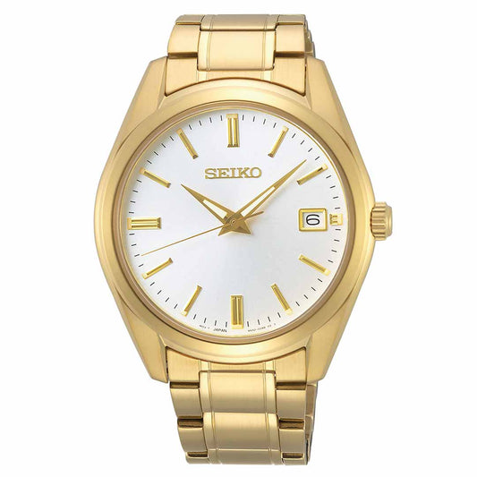 The Seiko Essentials Quartz 40.2mm Watch boasts a gold-plated finish with a white dial, featuring gold hour markers and a date display at the 3 o'clock position. The "Seiko" brand name is elegantly positioned beneath the 12 o'clock mark, and it is powered by the dependable Calibre 6N52 quartz movement within its gold metal bracelet.