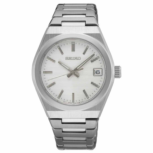 A Seiko Essentials Quartz 34mm watch, a silver wristwatch from the renowned brand Seiko, comes with a stainless steel bracelet. It showcases a white dial adorned with vertical stripes, silver hour markers, and a date window located at the three o'clock position, all safeguarded by a durable sapphire crystal.