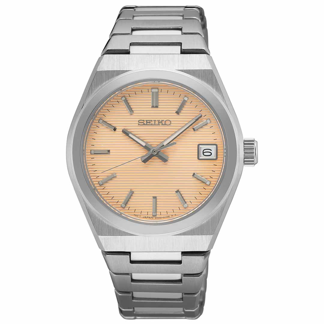 The Seiko Essentials Quartz 34mm Watch showcases a sophisticated design with its stainless steel strap and round beige dial. It features hour markers and hands, along with a convenient date window at the 3 o'clock position. The Seiko brand name is elegantly displayed on the dial.