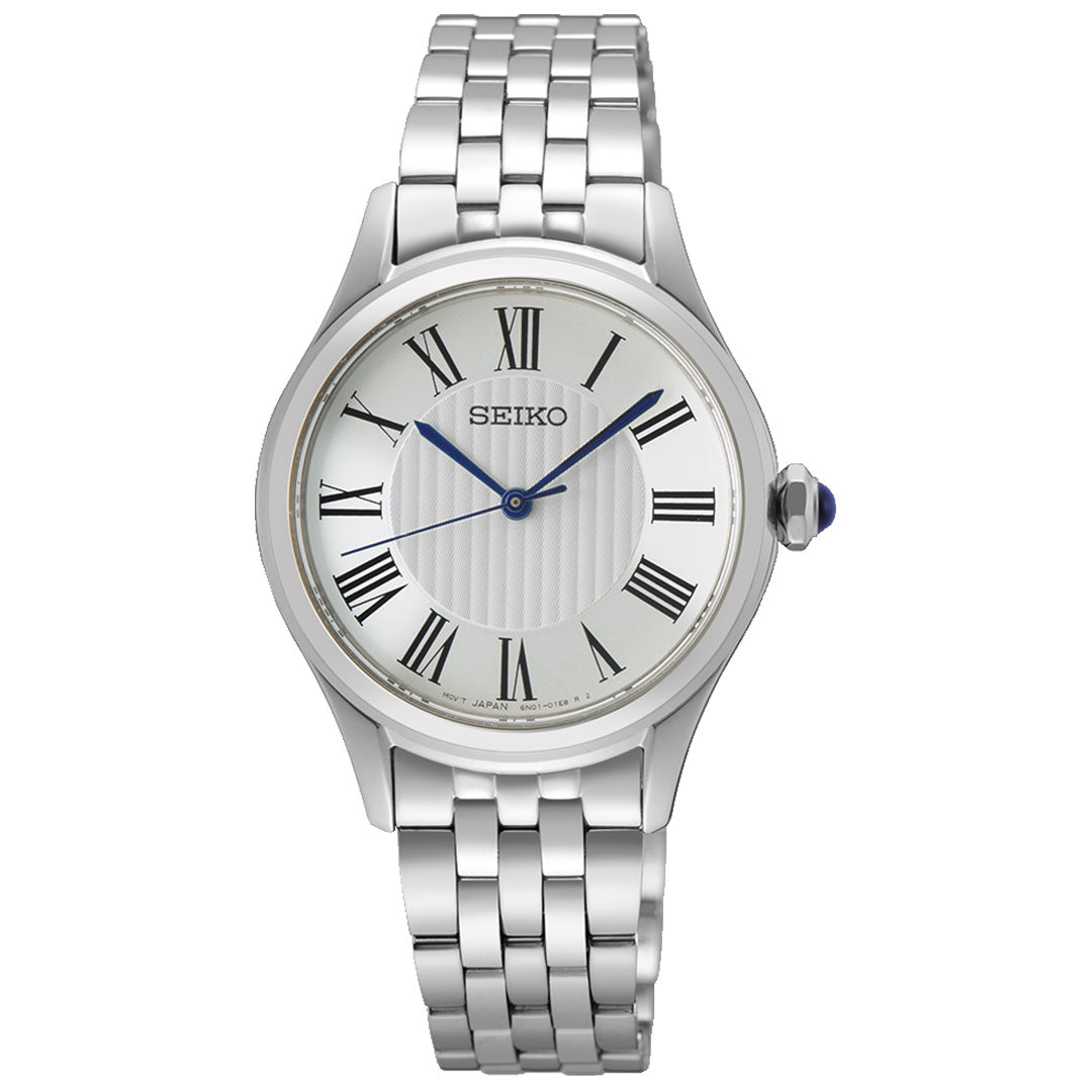 The Seiko Classic Quartz 29.6mm Watch features a silver metal link band, white face with black Roman numerals, blue hands, and a blue cabochon crown—a simple, elegant design by Seiko.