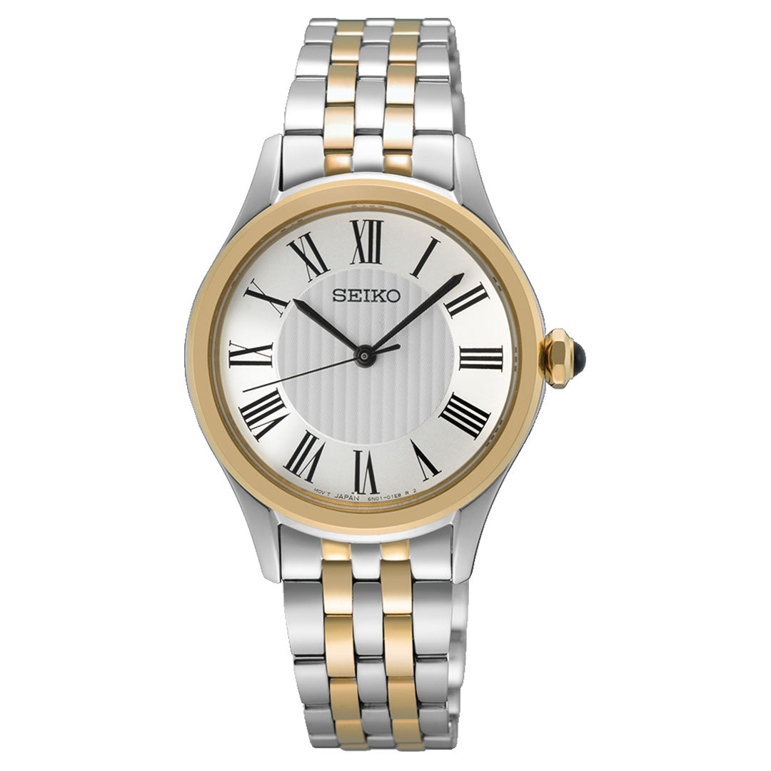 The Seiko Classic Quartz 29.6mm Watch features a silver and gold metal band, white round face, gold bezel, black Roman numerals, and black hands for a classic, elegant look.