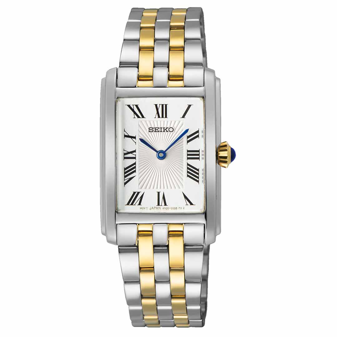 The Seiko Essentials Quartz 22.2mm Watch showcases a sophisticated rectangular design with a pristine white dial adorned with Roman numerals and black hands. Its silver and gold-plated bracelet enhances the elegance, while the quartz mechanism guarantees precision. A blue-tipped crown adds a refined flourish to this iconic Seiko timepiece.