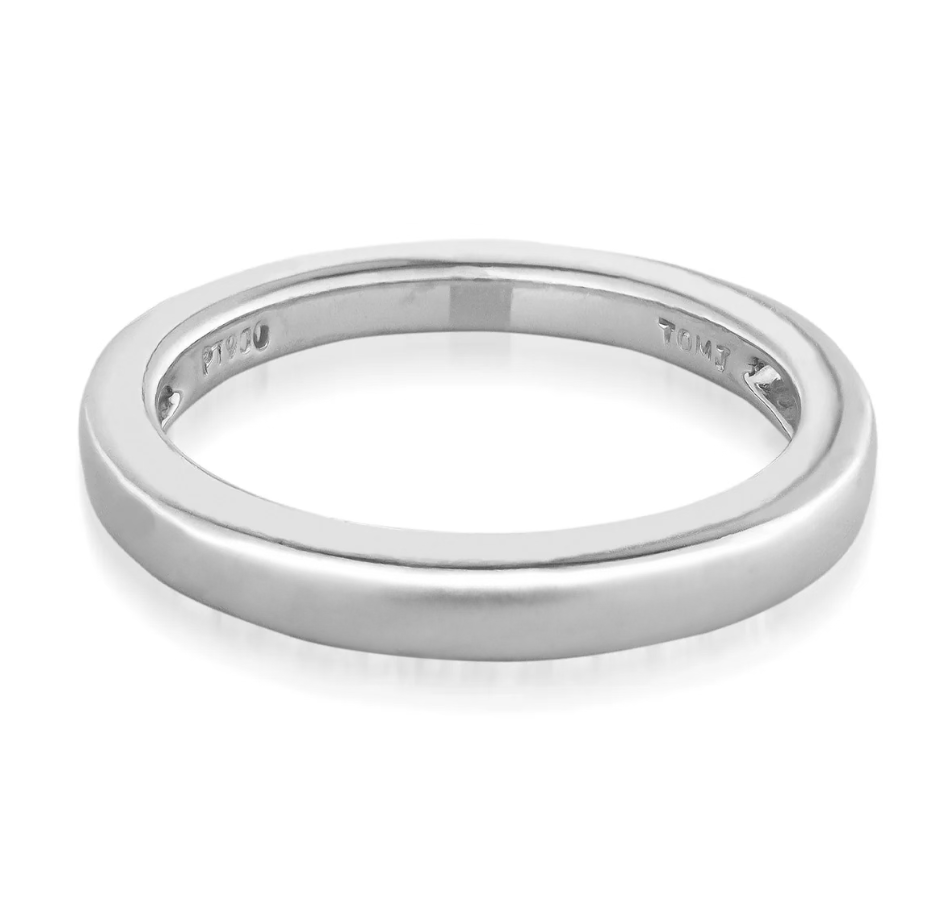 A sleek and sophisticated 14K white gold wedding band in size 5.5, featuring a smooth, polished finish. The interior of the ring is engraved with markings, including "PT 950." It is showcased against a plain white backdrop. This elegant piece is crafted by Raffi Jewellers - Canada.