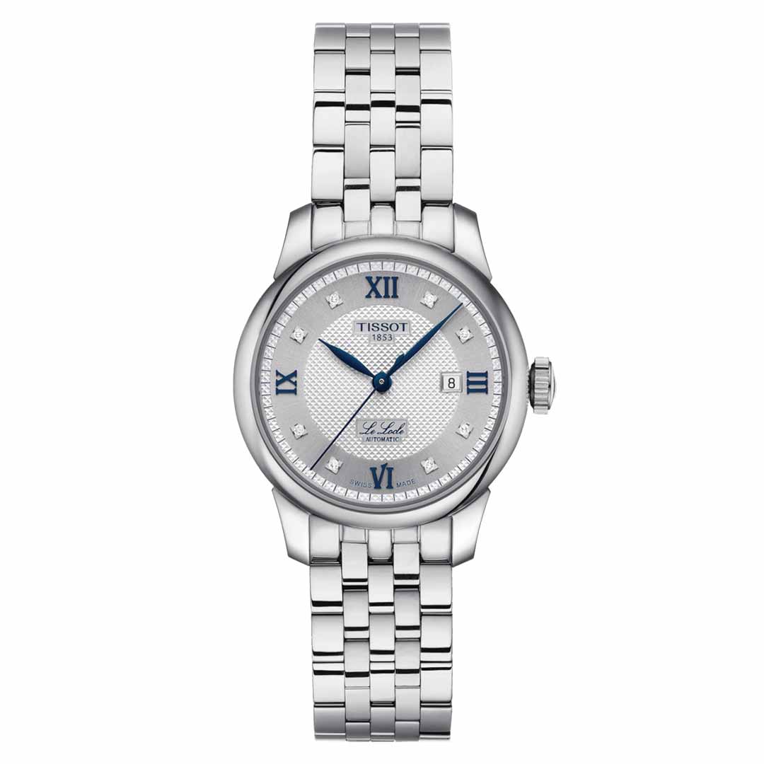 The sophisticated Tissot Le Locle Automatic 29mm Watch 20th Anniversary edition by Tissot features a stylish silver metallic link strap and an intricately designed dial adorned with Roman numerals. Its refined date display at the 3 o'clock position is complemented by elegant blue hour and minute hands.