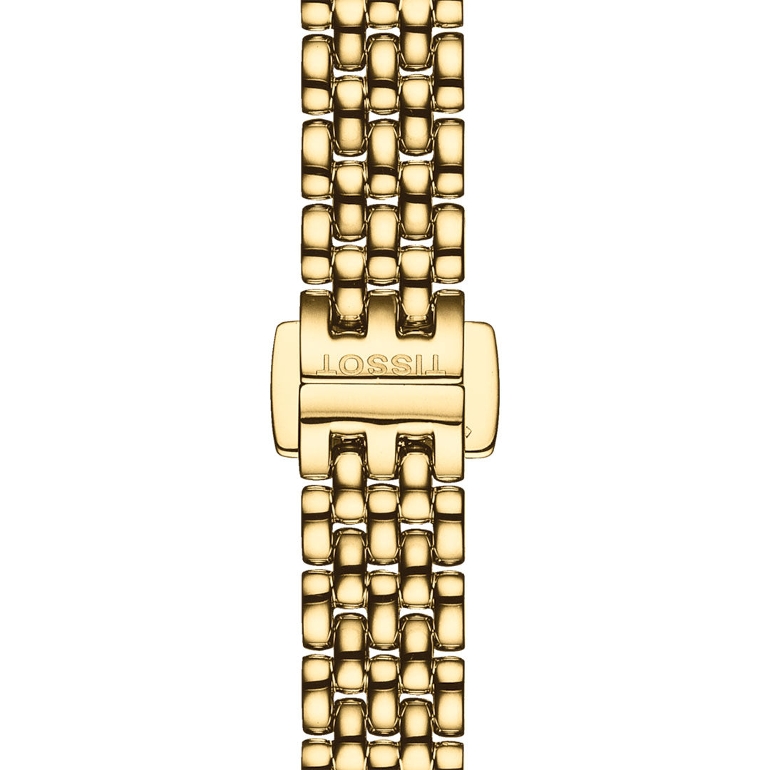 A close-up view showcases the clasp of the Tissot Lovely Quartz 19.5mm Watch, featuring the brand name "Tissot" elegantly engraved on it. This gold clasp is beautifully accented with miniature diamond details and is attached to a polished gold linked watchband, displayed in an upright position.